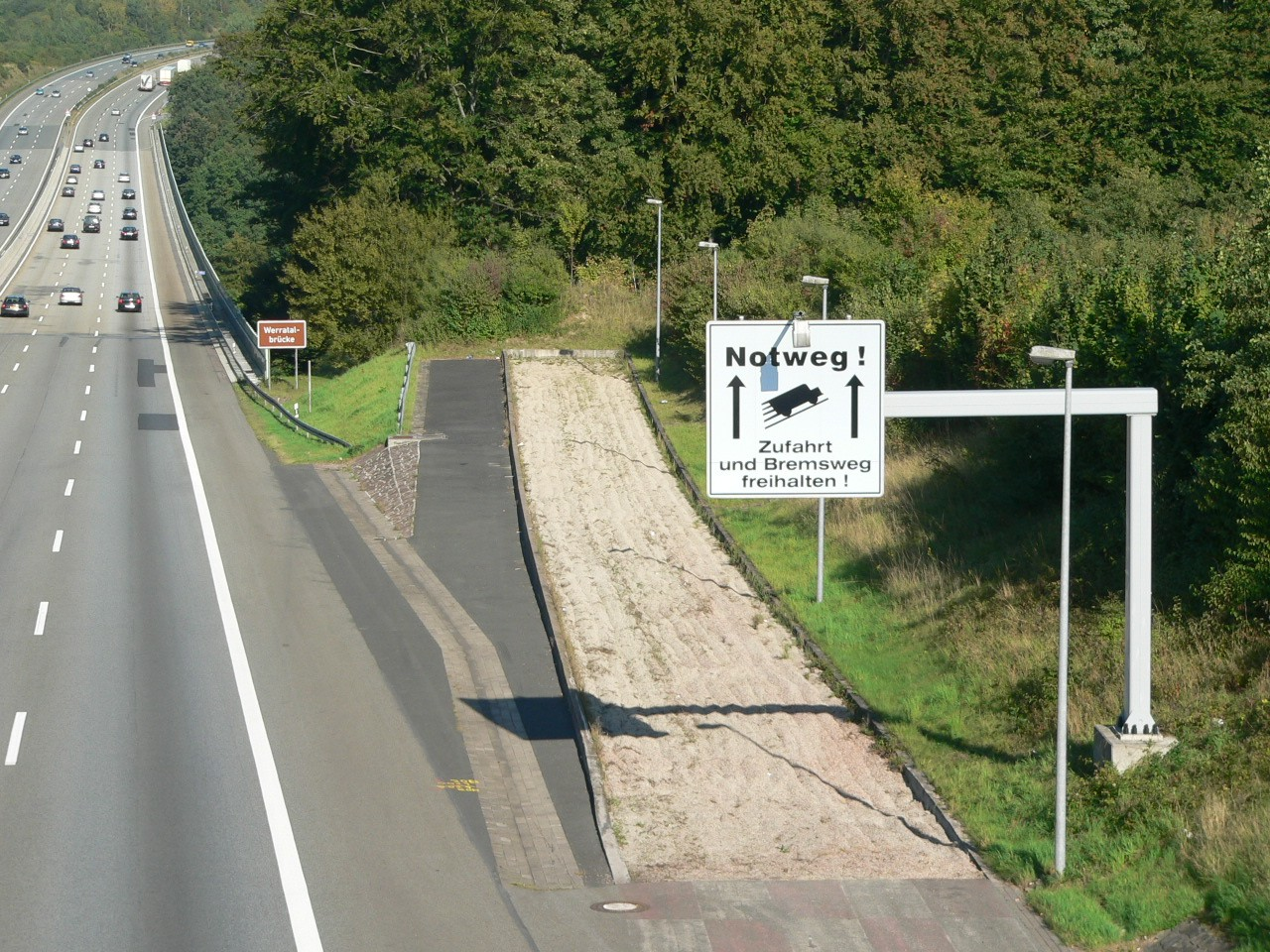 Truck escape ramp on highway illustrating how to plan the week with emergency buffers for unexpected chaos and disruption
