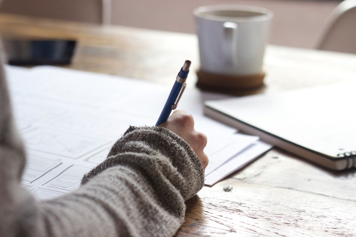 Person writing in a journal — finding your vocation starts with your earliest memory