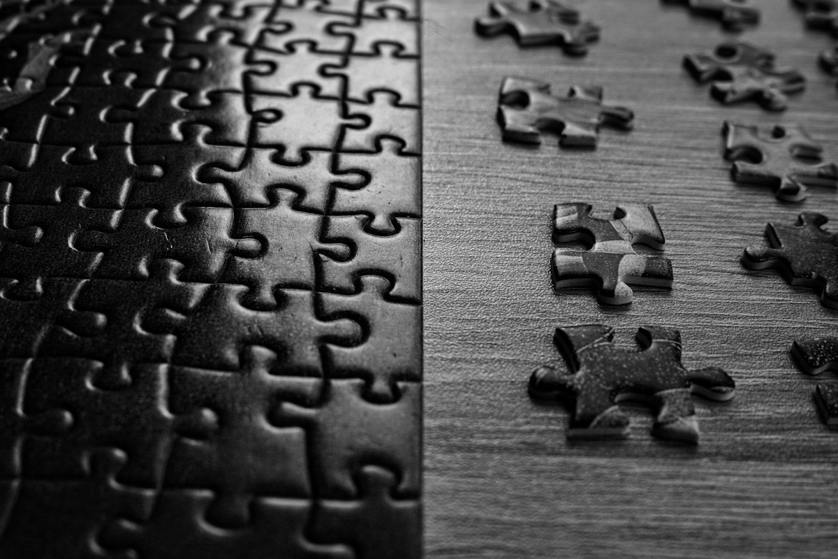A half-finished jigsaw puzzle on a table, the evening stop time that protects time management at home